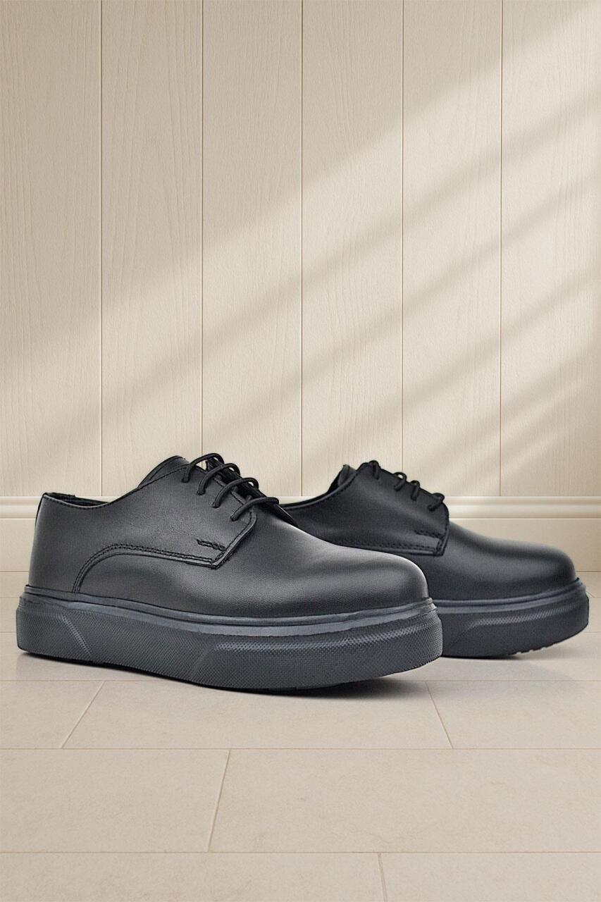 حذاء كلاسيكي للأطفال من راكر بلاس ديربي، مصنوع من الجلد الطبيعي باللون الأسود غير اللامع، ذو نعل عالٍ - 1